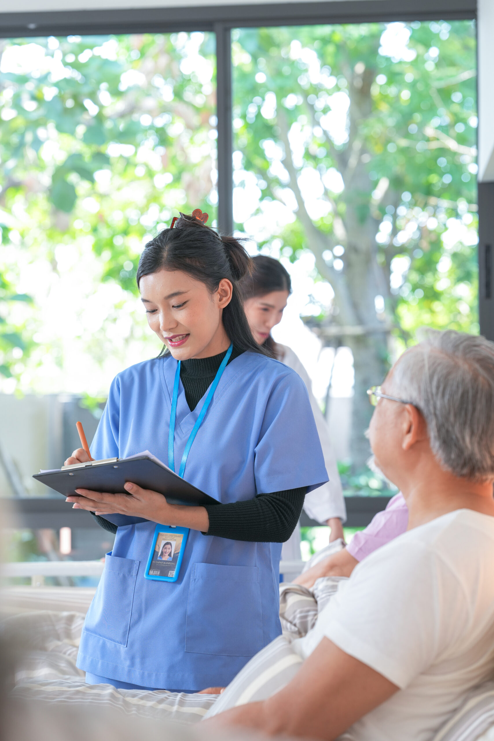 aged care: happy senior asian men and women talking and smiling